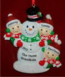 Our 3 Grandkids Building Large Snowman Christmas Ornament Personalized by Russell Rhodes